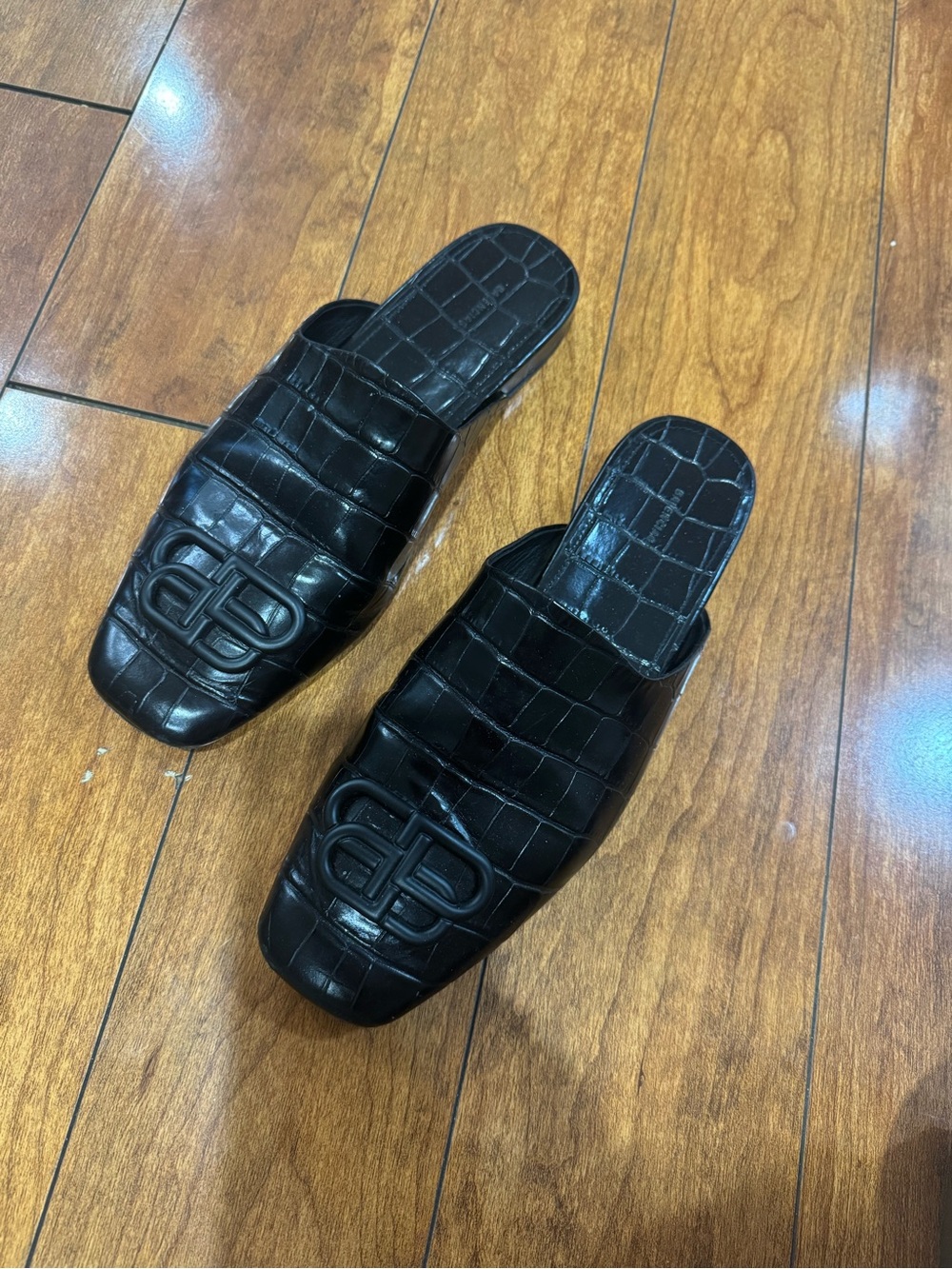 Valencia’s black leather mules